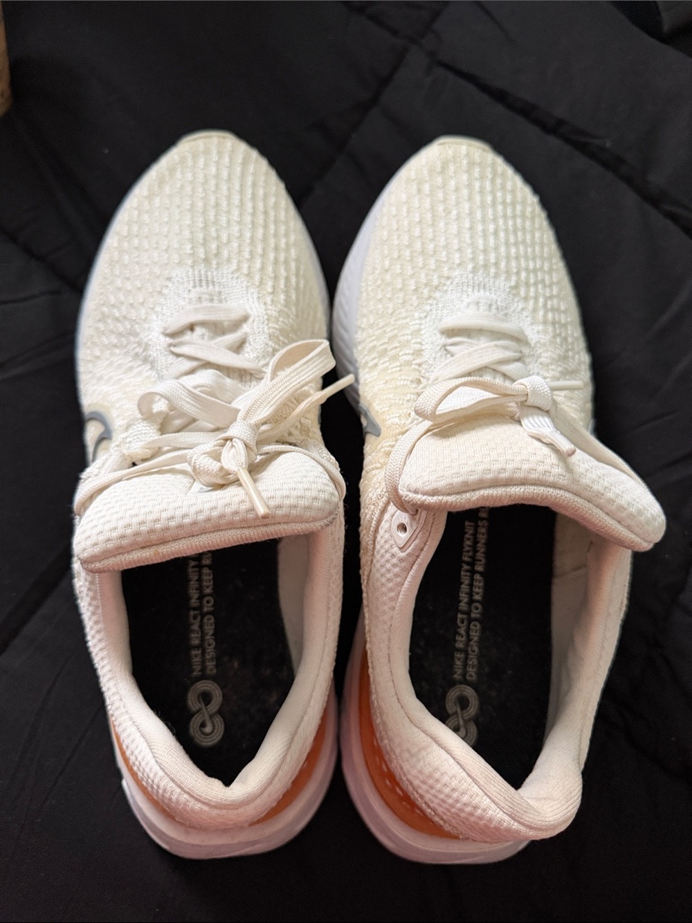 Nike Women’s Cream Knit Running Sneakers with Orange Heel Accent